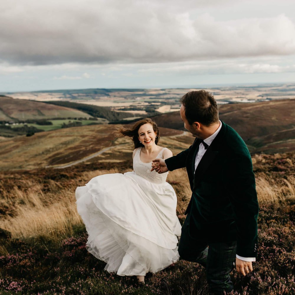 Scottish elopement planner scotland landscape bride groom at top of hills cairngorms