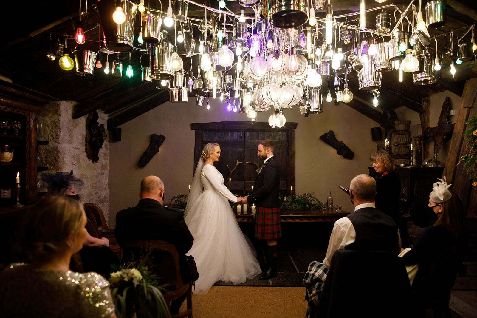 fife arms hotel braemar luxury boutique hotel light metal chandelier installation in wedding ceremony room