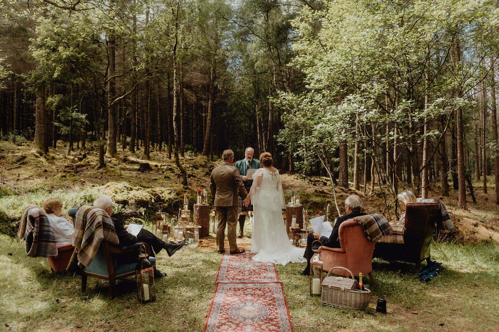 Glencoe elopement Scotland outdoor humanist ceremony with rugs and chairs styling by we are gloam rustic quirky romantic wedding setup