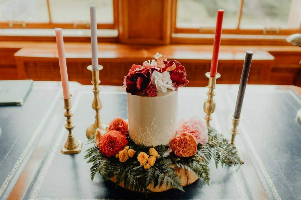 Glencoe elopement Scotland glencoe house reception dinner setup styling by we are gloam candles flowers stylish romantic table decoration cake by rosewood cakes