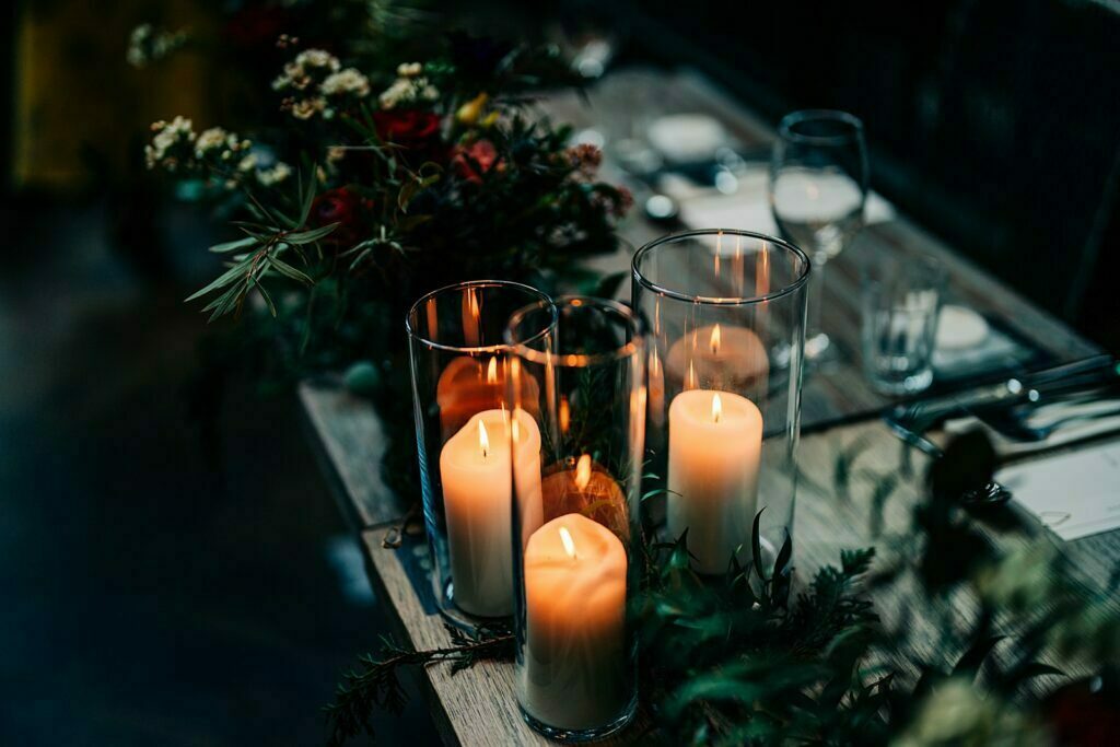 colourful forgans micro wedding green foliage tablescape wedding florals church candles