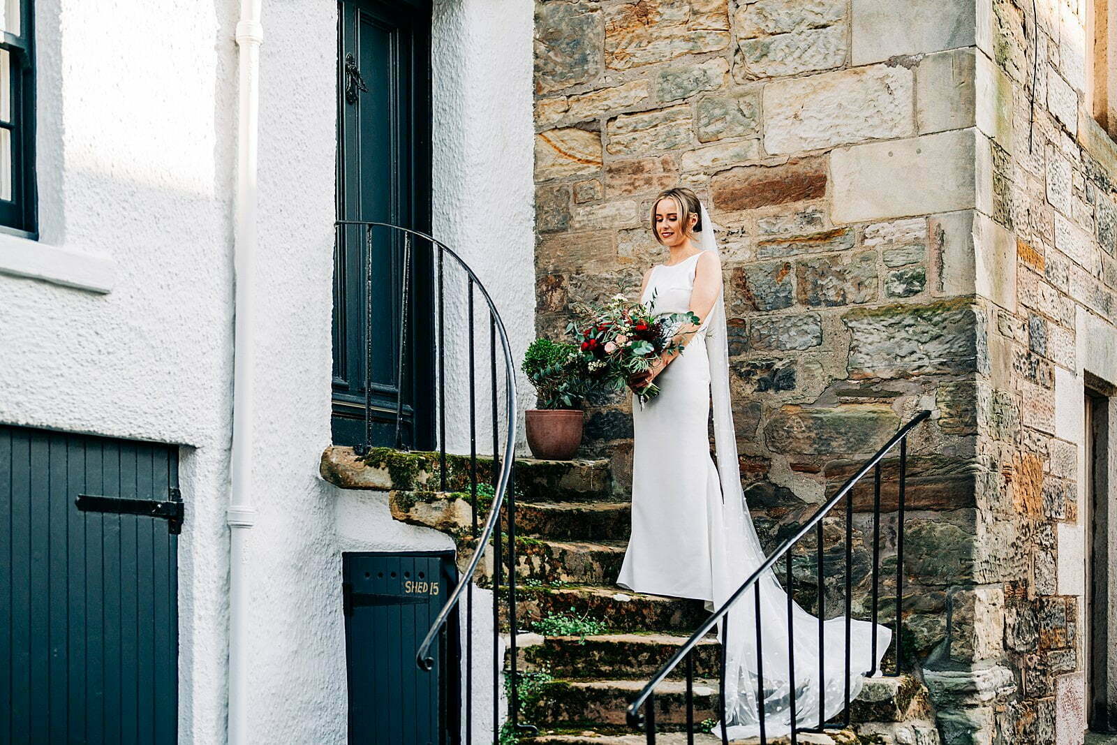 colourful forgans micro wedding st andrews coastal cottage stone staircase bride portrait
