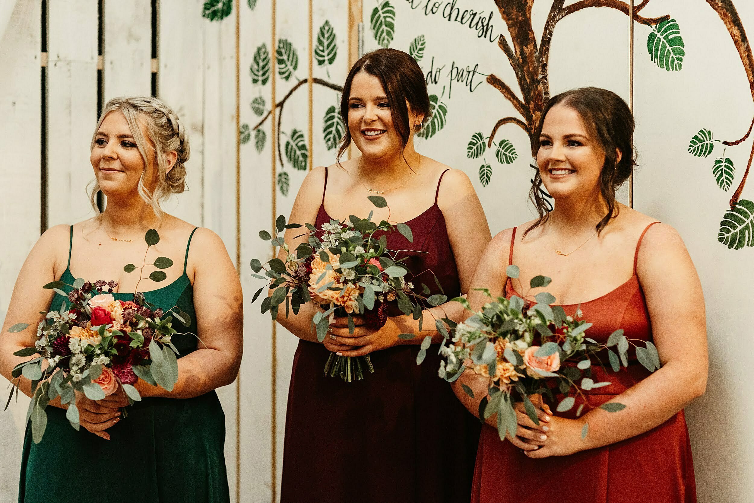 romantic autumnal micro wedding, platter + pop bridesmaid bouquets, jewel tone bridesmaid dresses, wed in a shed